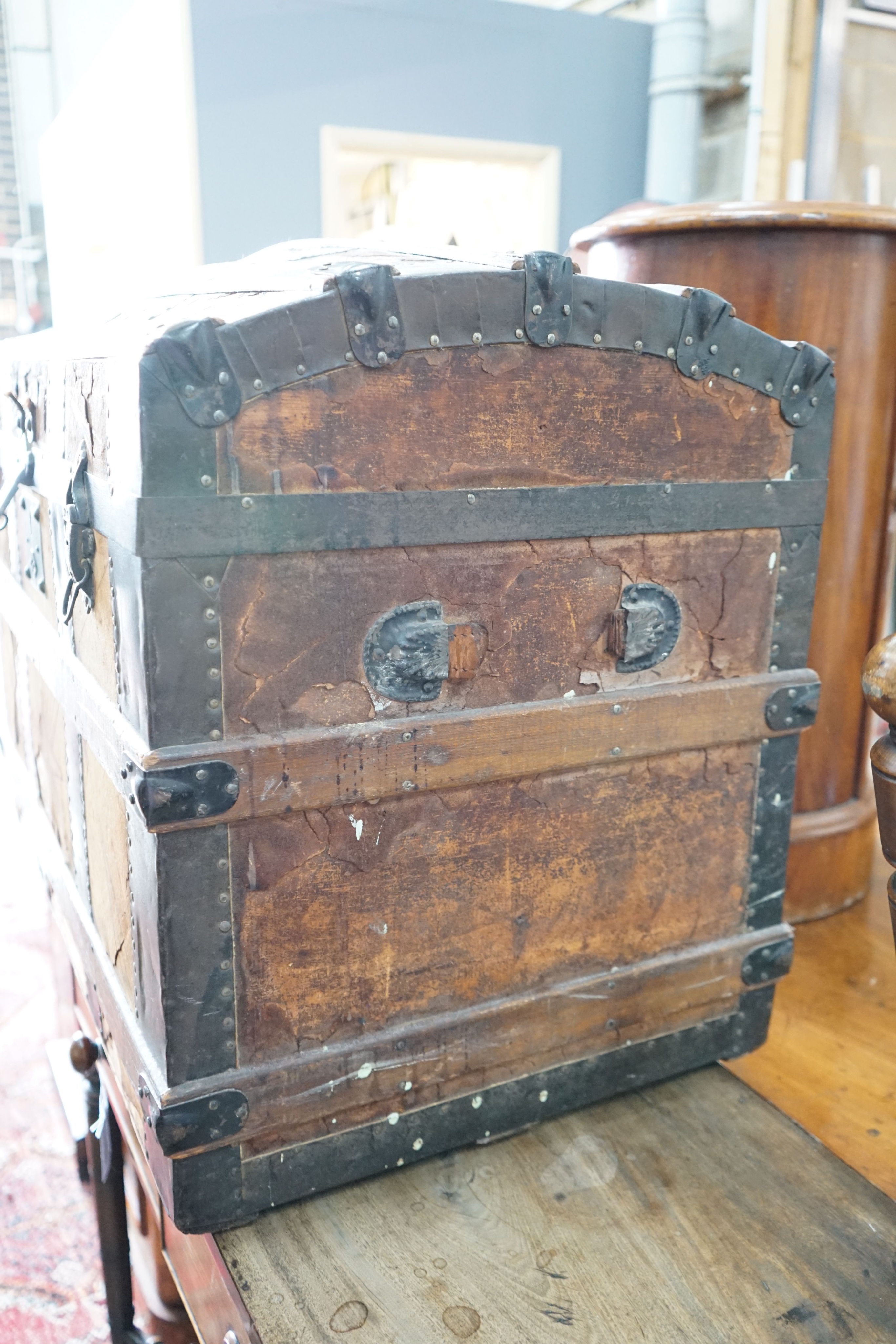 A late Victorian iron bound domed top trunk, length 82cm, depth 48cm, height 60cm